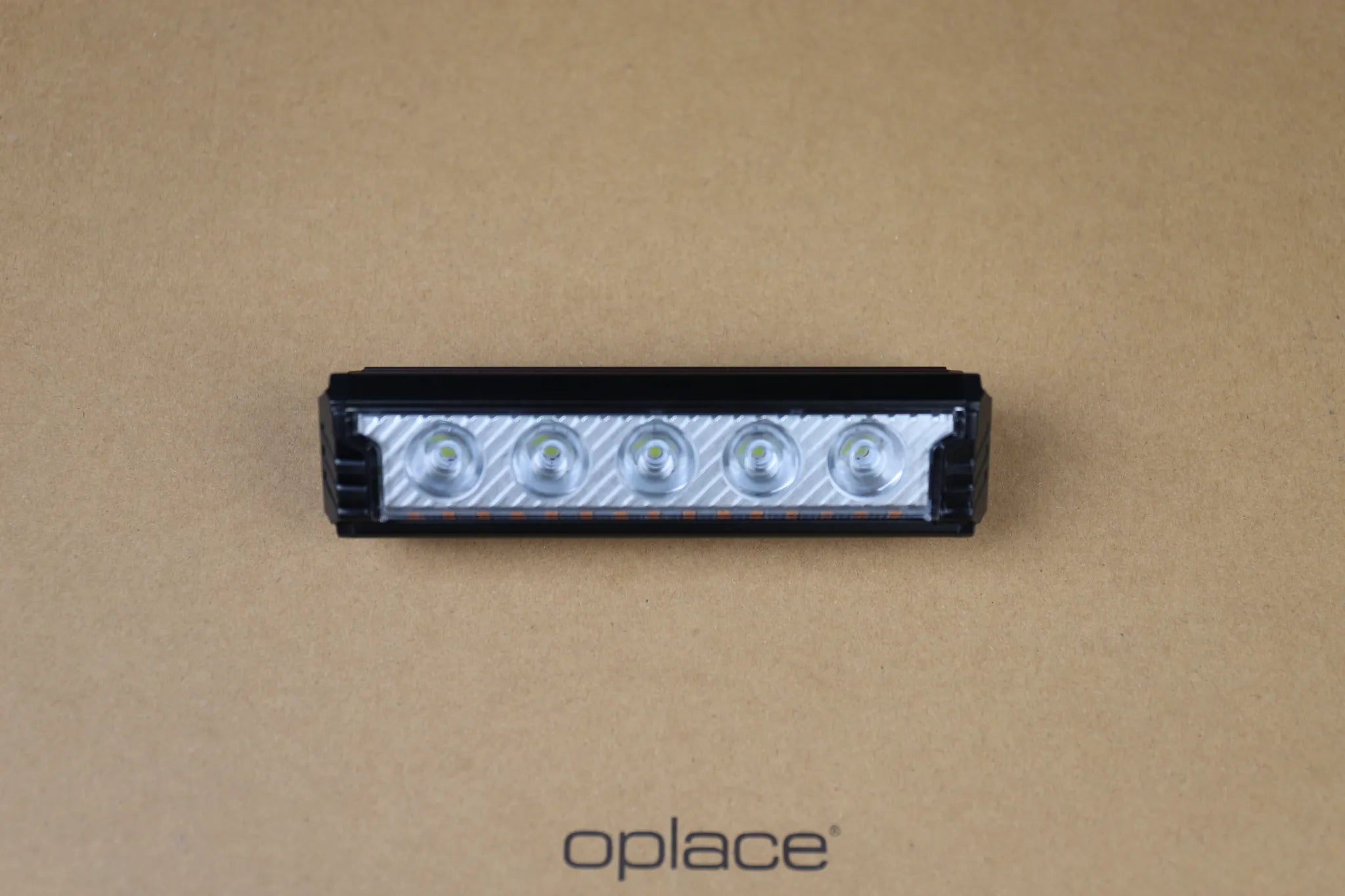 Multi-LED USB-C rechargeable bike front light shown close-up with its LED row visible