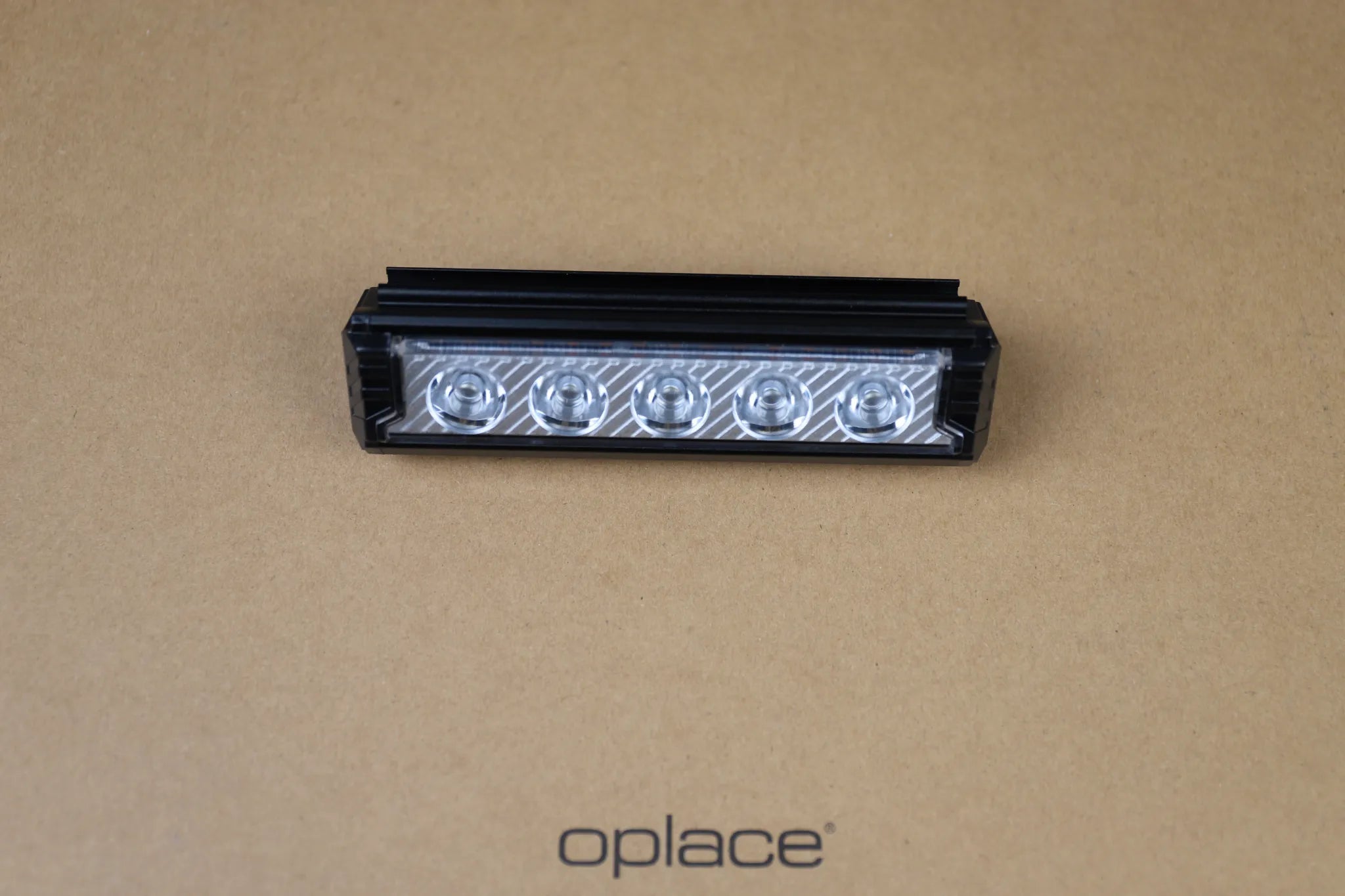 Black multi-LED USB-C rechargeable bike front light with a long row of visible lenses