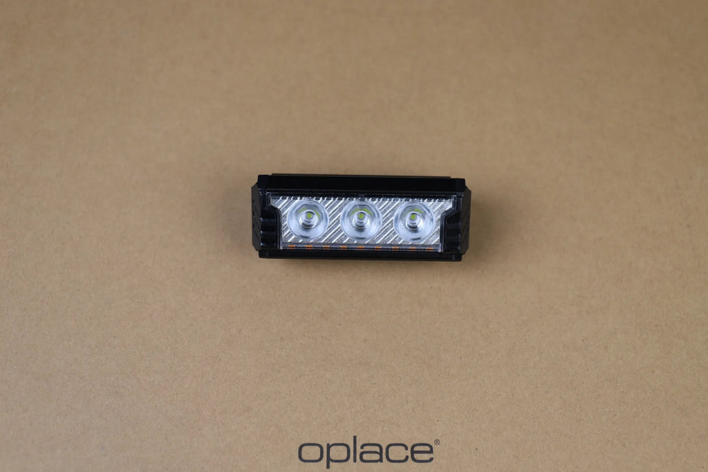 Multi-LED USB-C rechargeable bike front light shown from above on an OPlace background