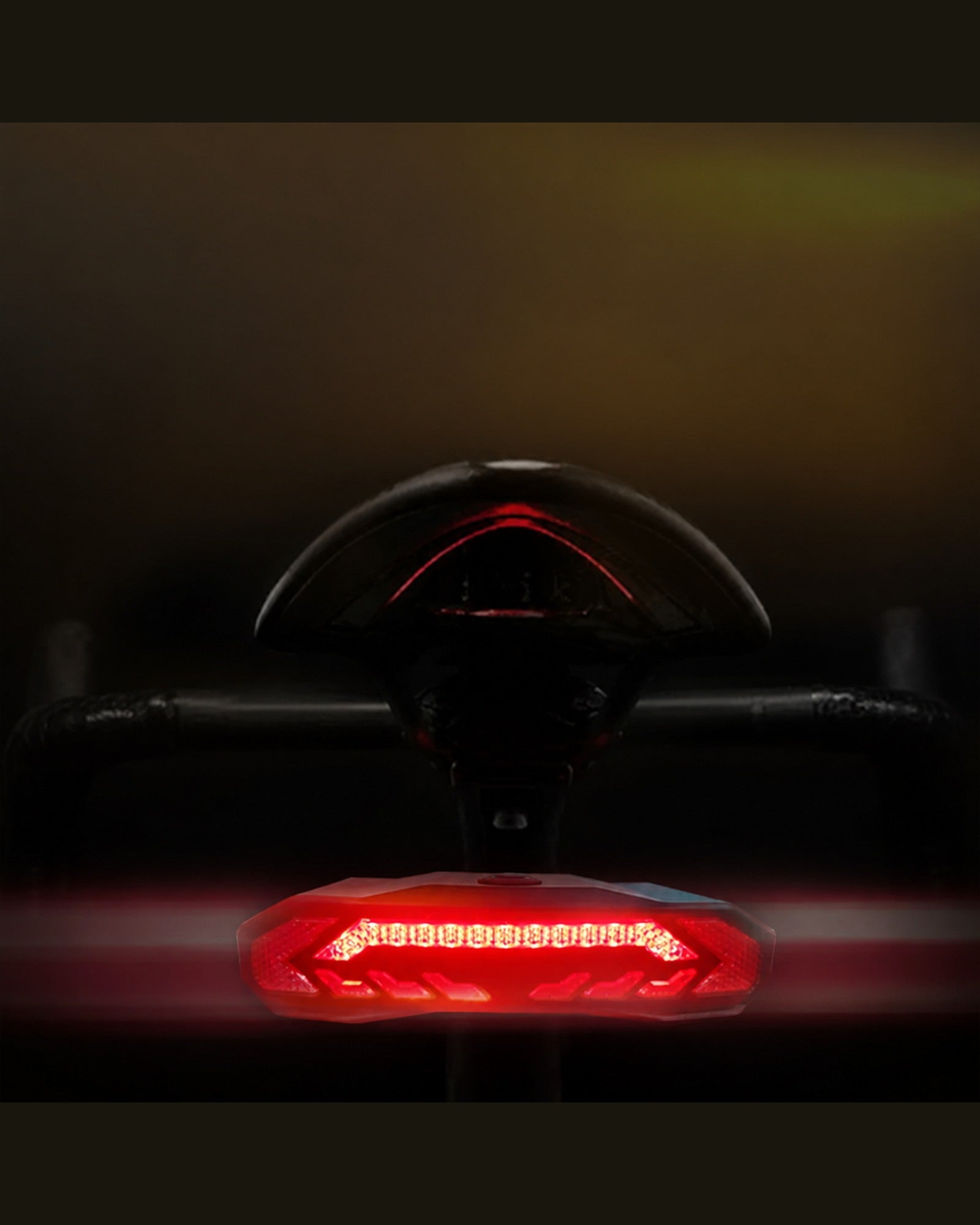 Brake-sensing bicycle tail light illuminated from the rear