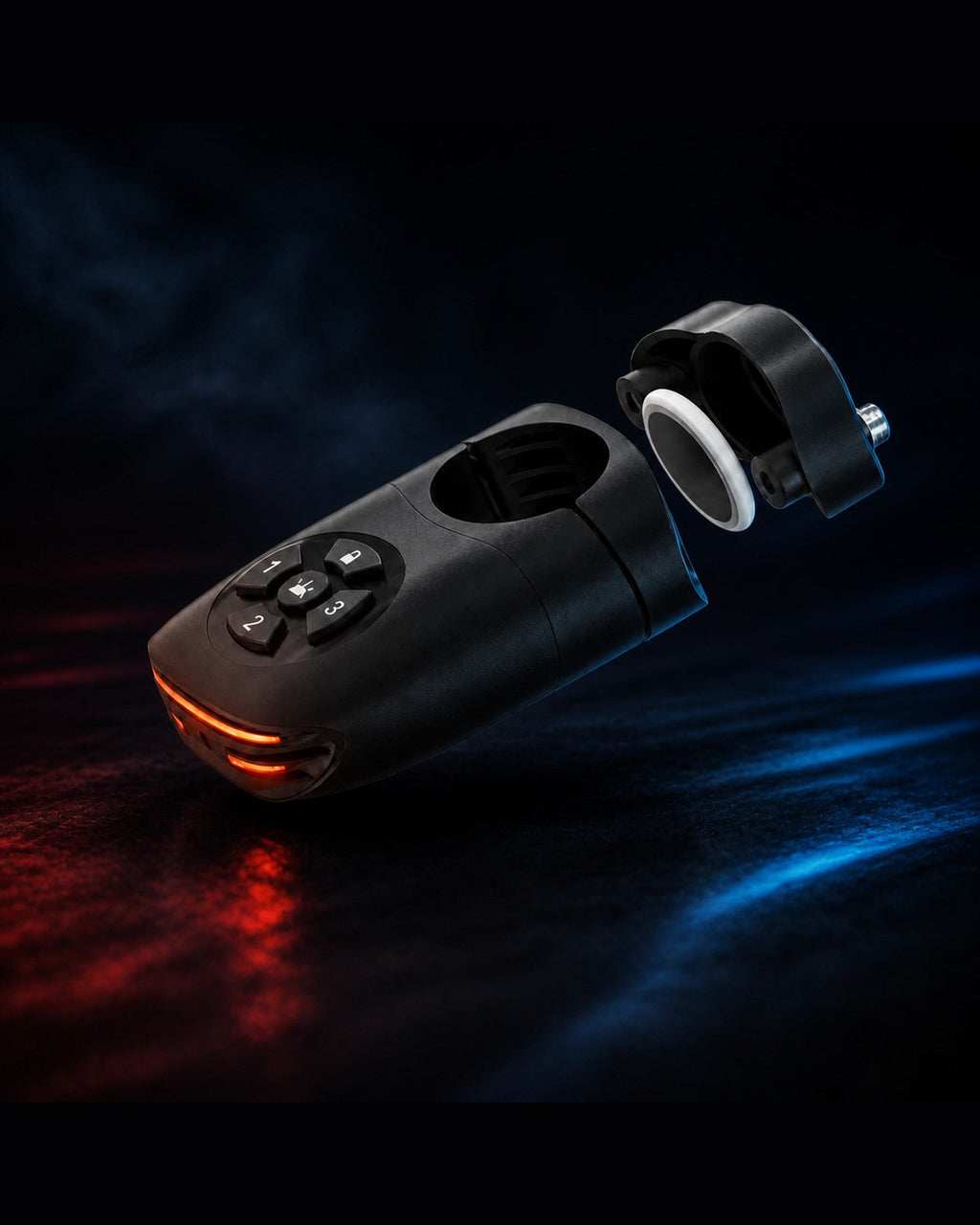 Find My-ready alarm bike tail light and remote photographed on a dark blue surface
