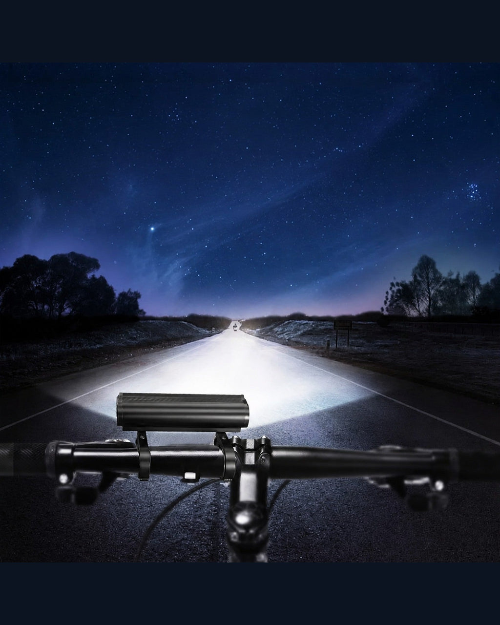 Multi-LED bike front light casting a wide beam along a road at night