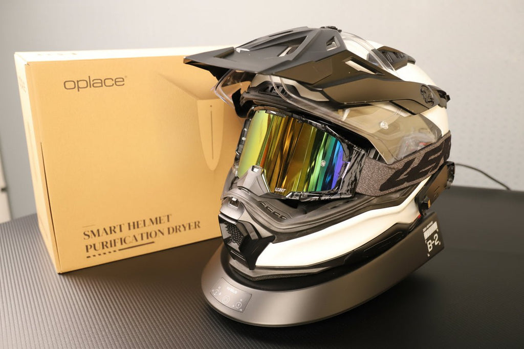 Smart Helmet and Gear Dryer Pro supporting a motocross helmet beside an OPlace box