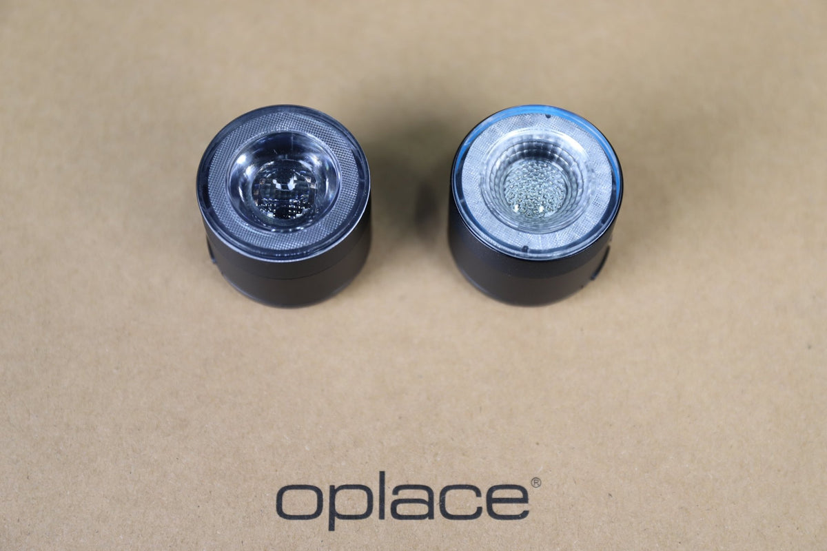 Pair of round RGB halo bike lights shown side by side on a kraft-colored background