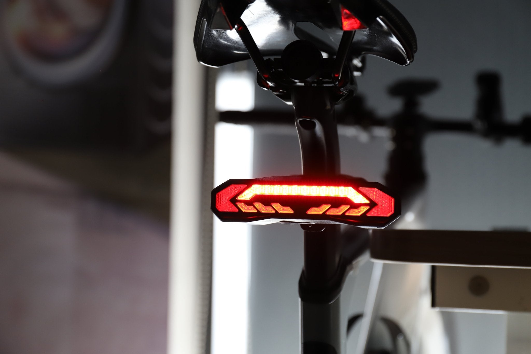Bright red full-light pattern on OPlace tail light mounted under a saddle