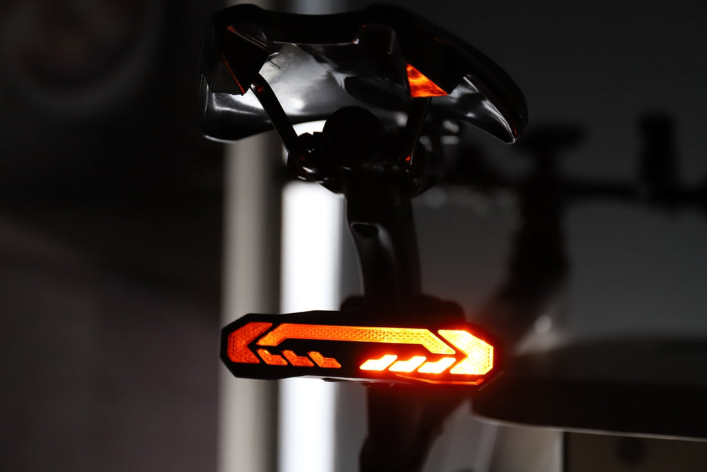 Red center-light pattern on OPlace tail light mounted under a saddle