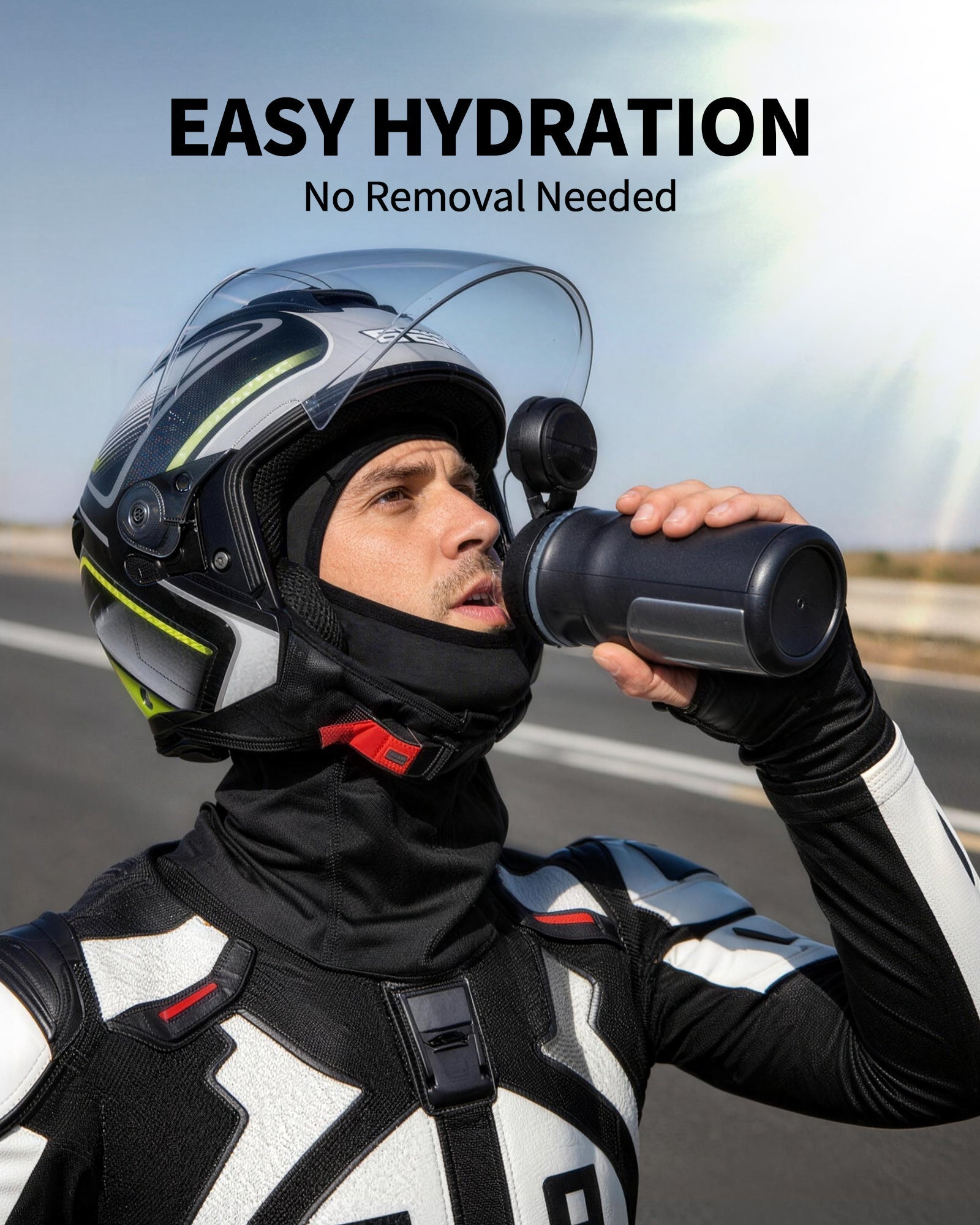 Motorcyclist drinking while wearing a black balaclava under an open-face helmet
